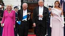 President Donald Trump and first lady Melania Trump greet Britain's King Charles III and Queen Camilla at the South Portico of the White House as they arrive for a State Dinner Tuesday, April 28, 2026, in Washington. (AP Photo/Alex Brandon)