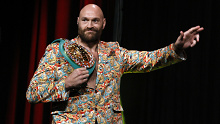 WBC heavyweight champion Tyson Fury arrives at a news conference.