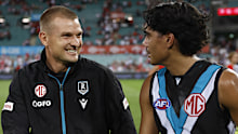 Ollie Wines and Jase Burgoyne of the Power walk from the ground after Port's match against the Swans.