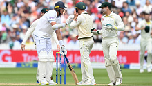Stuart Broad grounds his bat while looking at Marnus Labuschagne of Australia and Alex Carey after Jonny Bairstow's stumping.