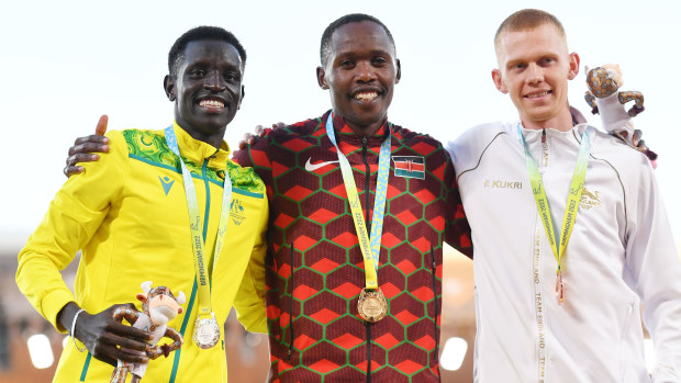 Silver medalist Peter Bol of Australia, gold medallist Wyclife Kinyamal of Kenya and bronze medallist Ben Pattison of England pose for a photo during the medal ceremony for the men's 800m final.
