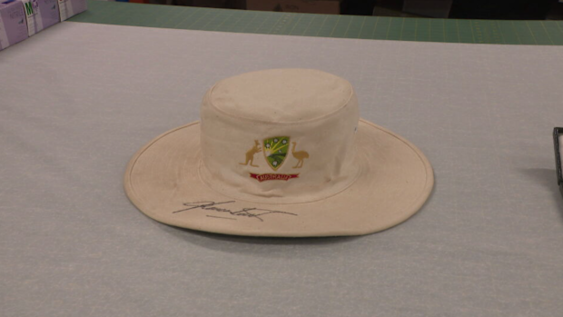 Warnie's white floppy hat is among the memorabilia on display.