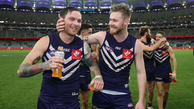 Nathan Wilson and Cam McCarthy of the Dockers walk from the field after winning the round 18 AFL match between the Fremantle Dockers and the Sydney Swans at Optus Stadium on July 20, 2019 in Perth, Australia. (Photo by Paul Kane/Getty Images)