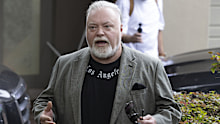 Radio host Kyle Sandilands briefly spoke to reporters as he left his home yesterday.