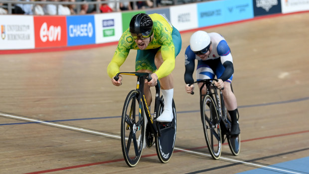 Matthew Glaetzer finishes ahead of Scotland's Jack Carlin in the third race of the men's sprint finals.