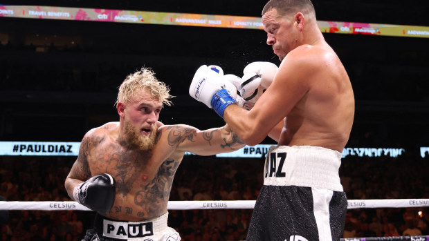 Jake Paul lands a blow on Nate Diaz in their pro boxing bout.