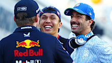 SINGAPORE, SINGAPORE - SEPTEMBER 22: Max Verstappen of the Netherlands and Oracle Red Bull Racing talks with Daniel Ricciardo of Australia and Visa Cash App RB on the drivers parade prior to the F1 Grand Prix of Singapore at Marina Bay Street Circuit on September 22, 2024 in Singapore, Singapore. (Photo by Mark Thompson/Getty Images)