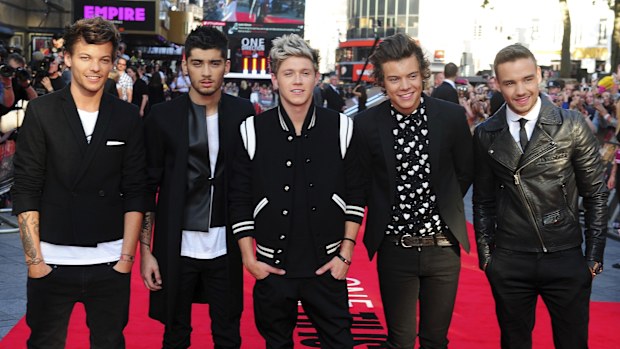 FILE - Louis Tomlinson, from left, Zayn Malik, Niall Horan, Harry Styles and Liam Payne arrive for the World Premiere of "One Direction: This Is Us," at the Empire Leicester Square, in London, Aug. 20, 2013. (Ian West/PA via AP, File)