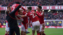 A man invades the pitch as Nottingham Forest celebrate scoring their side's third goal of the game.