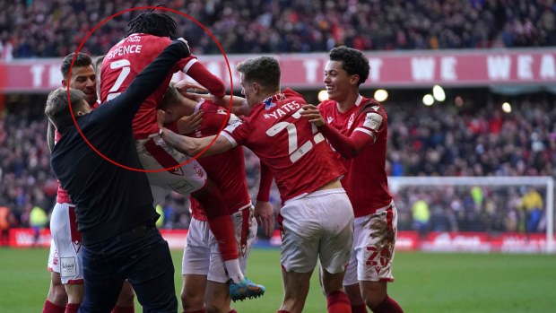 A man invades the pitch as Nottingham Forest celebrate scoring their side's third goal of the game.