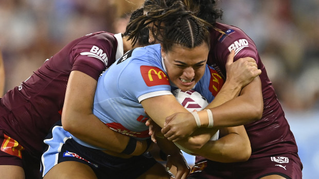 TOWNSVILLE, AUSTRALIA - JUNE 22: Millie Boyle of the Blues is tackled during game two of the women's state of origin series between New South Wales Skyblues and Queensland Maroons at Queensland Country Bank Stadium on June 22, 2023 in Townsville, Australia. (Photo by Ian Hitchcock/Getty Images)