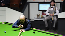 Belgium's Luca Brecel in action against China's Si Jiahui at the World Snooker Championship.