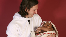 This photo taken in Sept. 2007 shows a 20-year-old Lionel Messi, who had embarked on his legendary Barcelona career just over four years prior, cradling Lamine Yamal, who was merely six months old at the time during a photo session in the dressing room of the Camp Nou stadium in Barcelona, Spain. Lamine Yamal is now a soccer sensation for both Spain and Barcelona and he is still only 16-years-old. (AP Photo/Joan Monfort)