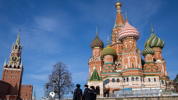 Police officers patrol Red Square, near the Kremlin, in Moscow, Russia.