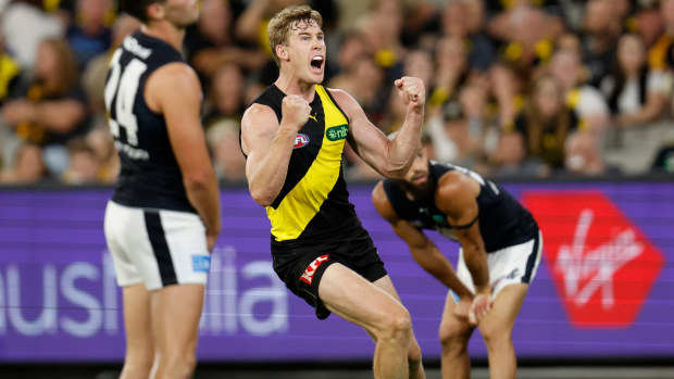 MELBOURNE, AUSTRALIA - MARCH 16: Tom Lynch of the Tigers celebrates a goal during the 2023 AFL Round 01 match between the Richmond Tigers and the Carlton Blues at the Melbourne Cricket Ground on March 16, 2023 in Melbourne, Australia. (Photo by Michael Willson/AFL Photos)