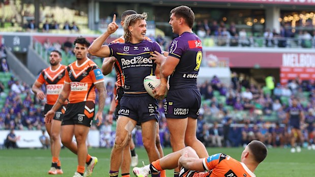 Ryan Papenhuyzen of the Storm celebrates after scoring a try.