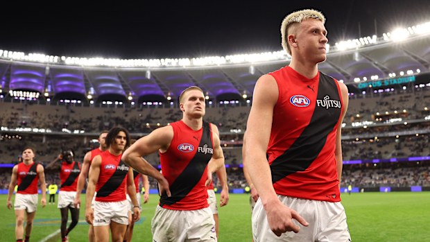 Essendon leave the field in Perth.
