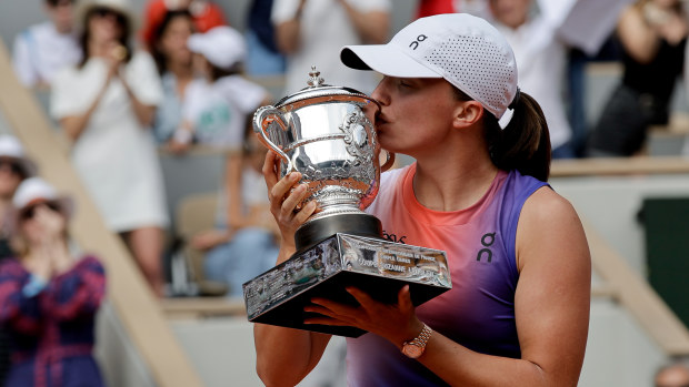 Iga Swiatek of Poland hold the cup after winning against Jasmine Paolini of Italy (not seen) during the Women's Singles Final match on day fourteen of the 2024 French Open at Roland Garros Complex in Paris, France on June 8, 2024. (Photo by Antonio Borga/Anadolu via Getty Images)