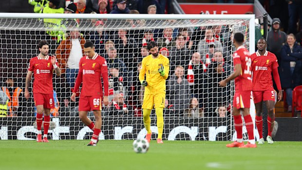 Alisson Becker of Liverpool reacts after Ousmane Dembele of Paris Saint-Germain scores.