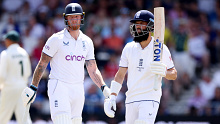 Moeen Ali (right) of England leaves the field after being dismissed by Australia captain Pat Cummins.
