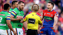 Tyson Gamble of the Knights shows referee Ashley Klein what he claimed to be bite marks from Wighton