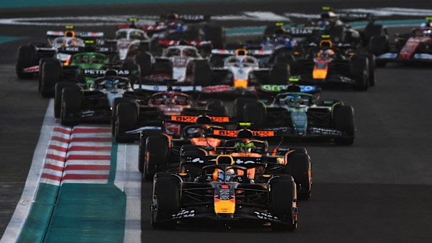 Max Verstappen leads Lando Norris and the rest of the field at the start during the 2025 Abu Dhabi Grand Prix.