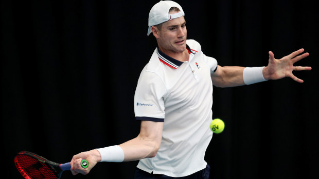 John Isner plays a forehand during his singles match against Gregoire Barrere during day two of the 2023 ASB Classic at the ASB Tennis Arena in Auckland.