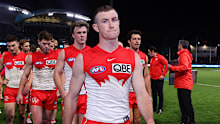 Chad Warner walks off after the Swans 112-point loss to the Power in round 21.