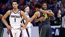 INDIANAPOLIS, INDIANA - APRIL 05: MaCio Teague #31 hugs Jared Butler #12 of the Baylor Bears during the National Championship game of the 2021 NCAA Men's Basketball Tournament against the Gonzaga Bulldogs at Lucas Oil Stadium on April 05, 2021 in Indianapolis, Indiana. (Photo by Jamie Squire/Getty Images)