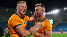 Reece Hodge and Quade Cooper of the Wallabies celebrate.