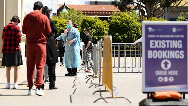 People enter the Vaccination Centre at Royal Exhibition Building in Carlton, Melbourne.