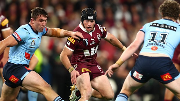 Harry Grant of the Maroons kicks the ball during game three of the 2024 State of Origin series.