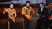 LONDON, ENGLAND - FEBRUARY 18: Oscar Piastri of Australia and McLaren waves to the crowd as Lando Norris of Great Britain and McLaren is interviewed by Martin Brundle during F1 75 Live at The O2 Arena on February 18, 2025 in London, England. (Photo by Clive Mason - Formula 1/Formula 1 via Getty Images)