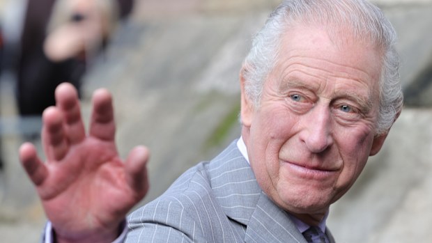 King Charles III waves to well-wishers as he arrives for the Welcoming Ceremony to the City of York at Micklegate Bar with Camilla, Queen Consort during an official visit to Yorkshire on November 09, 2022 in York, England 