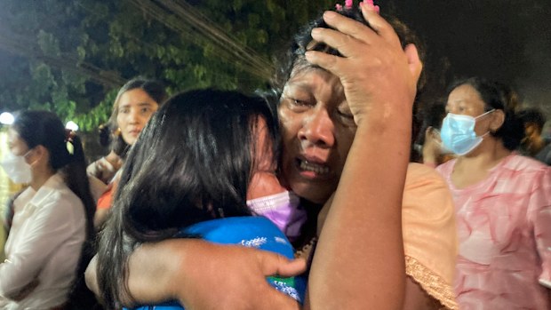 A mother reacts after her daughter, left, was released from Insein Prison in Yangon, Myanmar. 