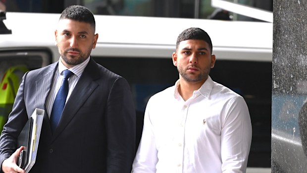 Amateur boxer Adam Abdallah (right) arrives at the Downing Centre Local Court, in Sydney, Wednesday, February 26, 2025. (AAP Image/Dean Lewins)
