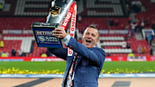 Hull KR head coach Willie Peters with the trophy as he celebrates after the Betfred Super League Grand Final at Old Trafford, Manchester. Picture date: Saturday October 11, 2025. (Photo by Martin Rickett/PA Images via Getty Images)
