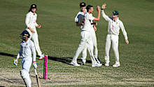 Josh Hazlewood of Australia celebrates after taking the wicket of Shubman Gill of India.