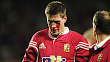 Ronan O''Gara of the British Lions leaves the field bleeding after an assault by Duncan McRae of the Waratahs.