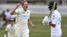 New Zealand bowler Kyle Jamieson celebrates the wicket of Pakistan's Shan Masood, right, during play on day two of the first cricket test between Pakistan and New Zealand at Bay Oval, Mount Maunganui, New Zealand, Sunday, Dec. 27, 2020. (Andrew Cornaga/Photosport via AP)