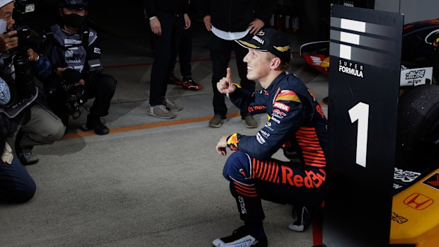 Winner Liam Lawson celebrates in parc ferme at Fuji International Speedway.