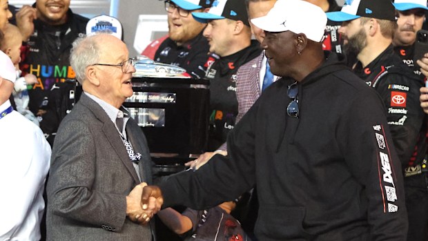 23Xi co-owner Michael Jordan shakes hands with Jim France.