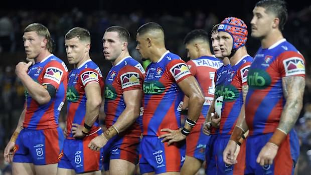 Knights players react to an Eels try.