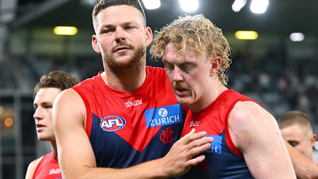 Steven May and Clayton Oliver of the Demons look dejected after losing the round four AFL match between Geelong Cats and Melbourne Demons at GMHBA Stadium, on April 04, 2025, in Geelong, Australia. (Photo by Quinn Rooney/Getty Images)