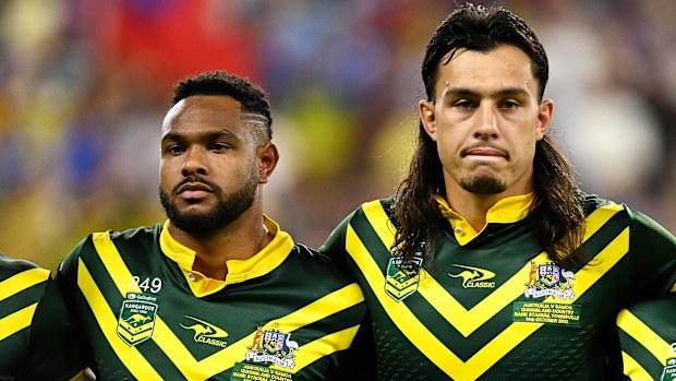 Hamiso Tabuai-Fidow, Tino Fa'asuamaleaui and harry Grant line up for the national anthems during the Pacific Championship match between Australia Kangaroos and Samoa at Queensland Country Bank Stadium on October 14, 2023 in Townsville, Australia. (Photo by Ian Hitchcock/Getty Images)