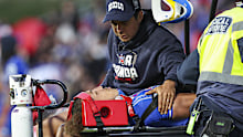 Ata Mariota is attended to by medical staff. 