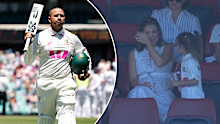 Usman Khawaja leaves the field as his wife Rachel cries in the crowd.