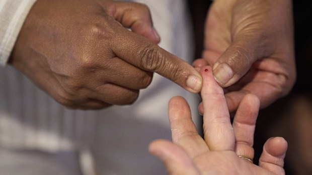A drop of blood is drawn to measure glucose levels and screen for diabetes.