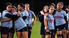 Waratahs players gather together following the final. 
