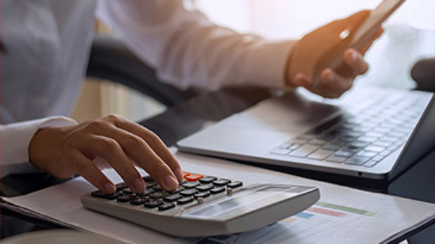 Stock image of woman in home office (Getty)
